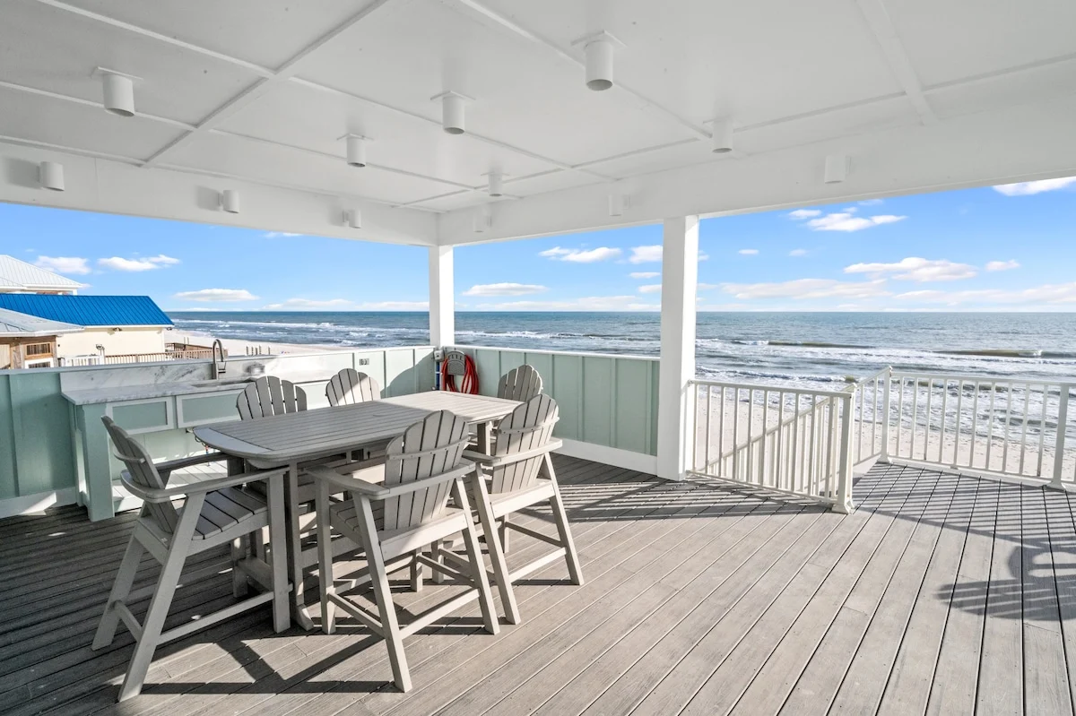 Covered deck with dining table and Gulf views, Sea Bliss