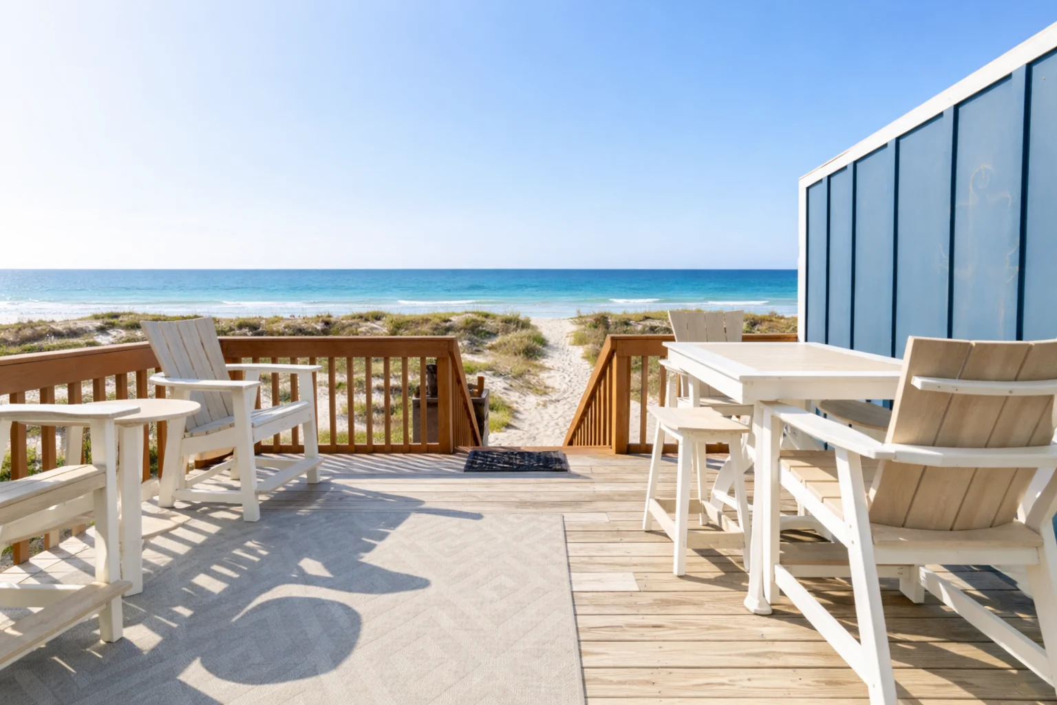 Gulf-facing deck with dining table and dune view, SouthWind East