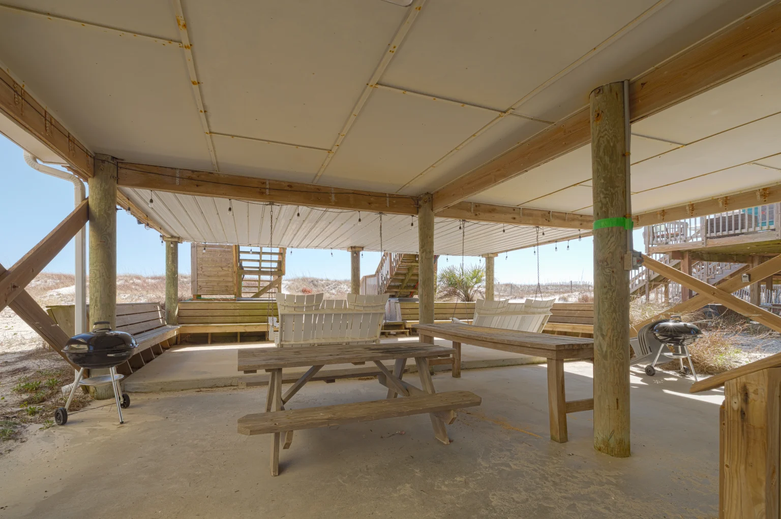 Covered picnic area and grills under the house, SouthWind East
