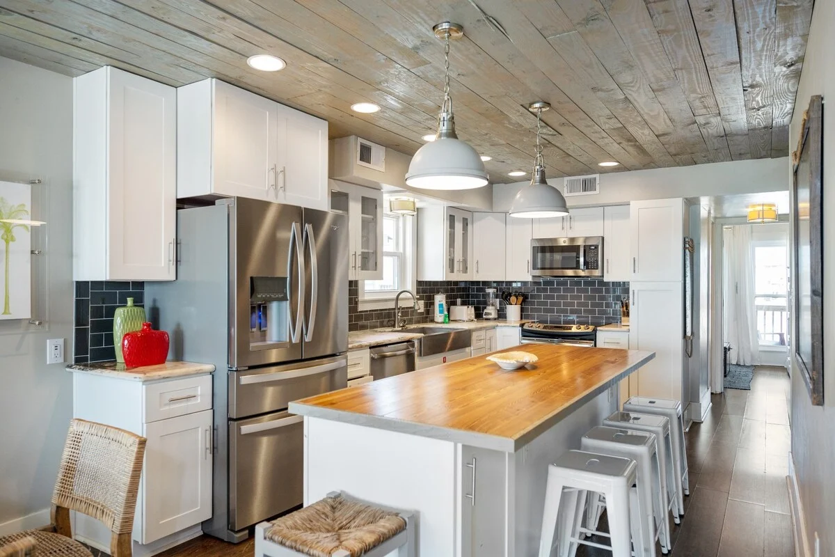 Kitchen and island seating toward the hallway, SouthWind West