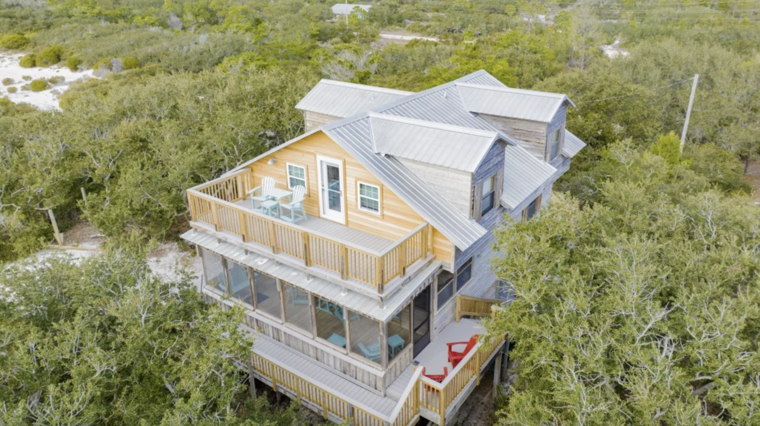 Raised beach house among the trees from the air, Tree Tops