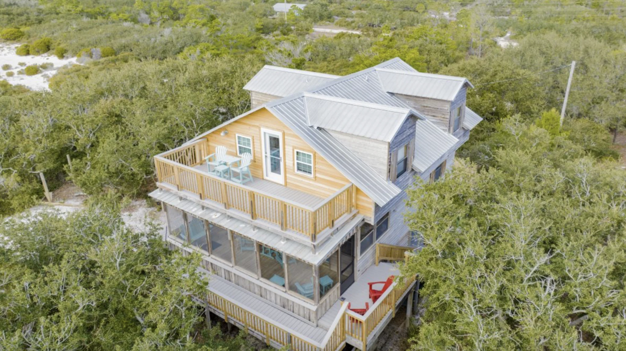 Raised beach house among the trees from the air, Tree Tops