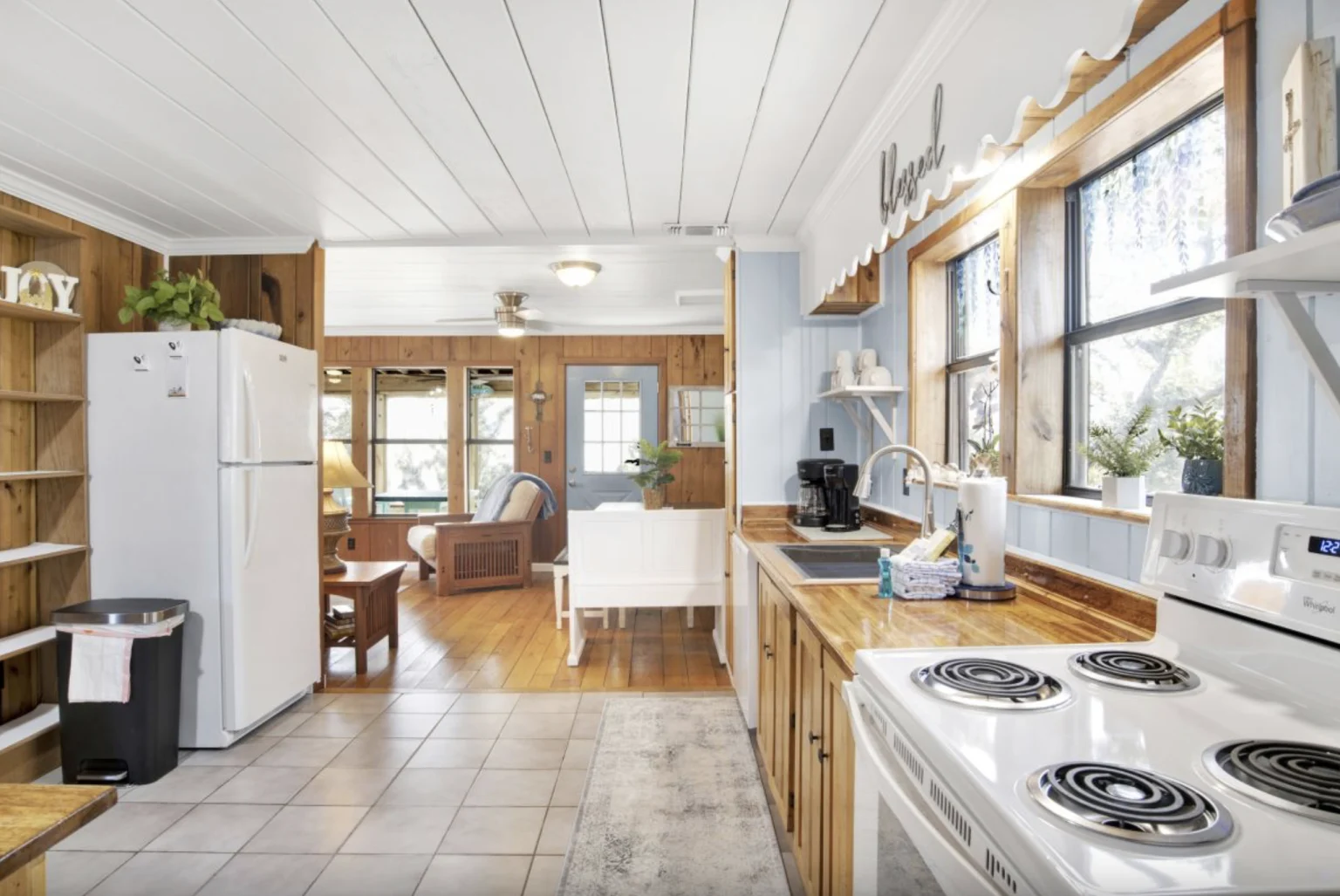 Kitchen with white appliances and tile floor, Tree Tops