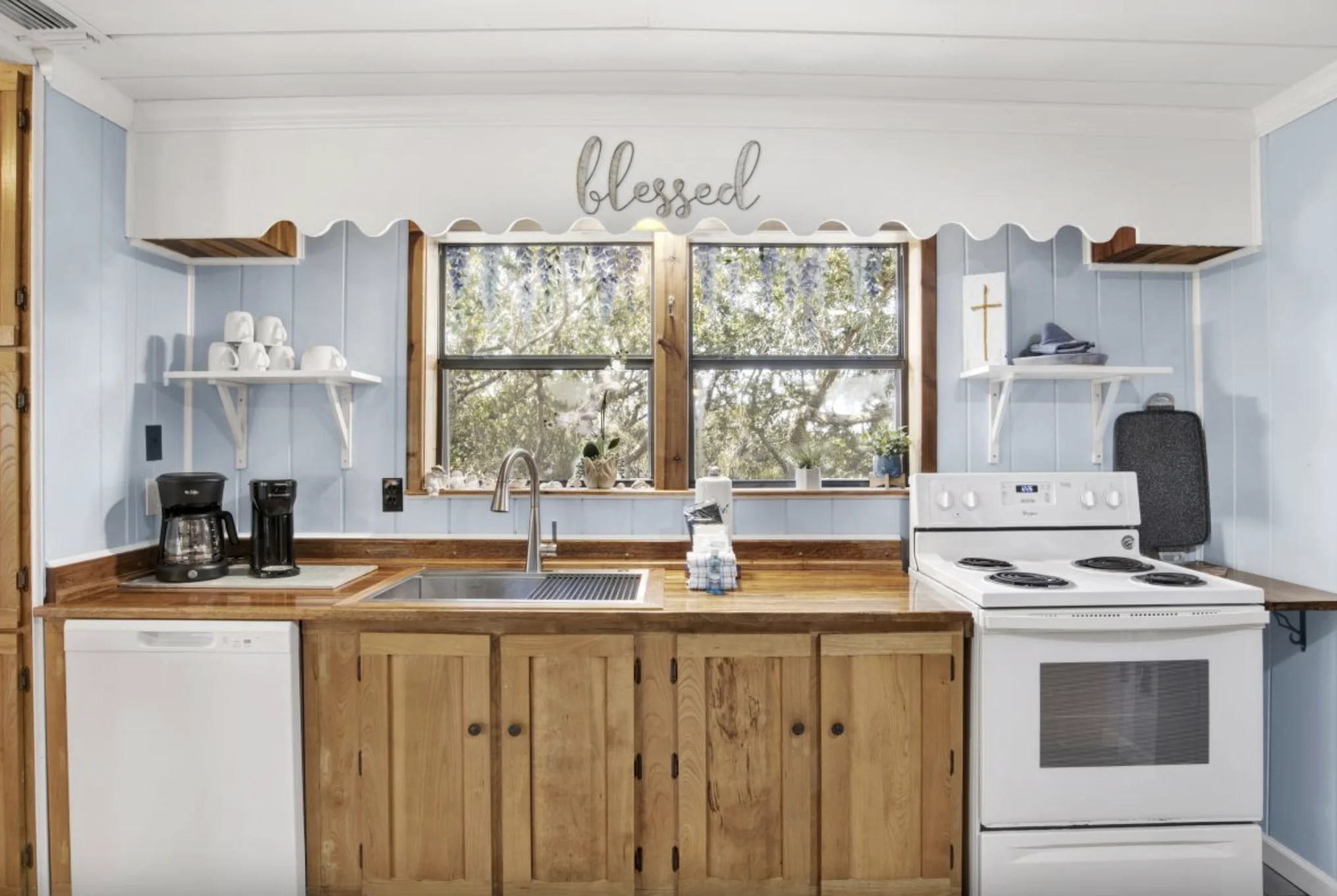 Kitchen sink under tree-view windows, Tree Tops