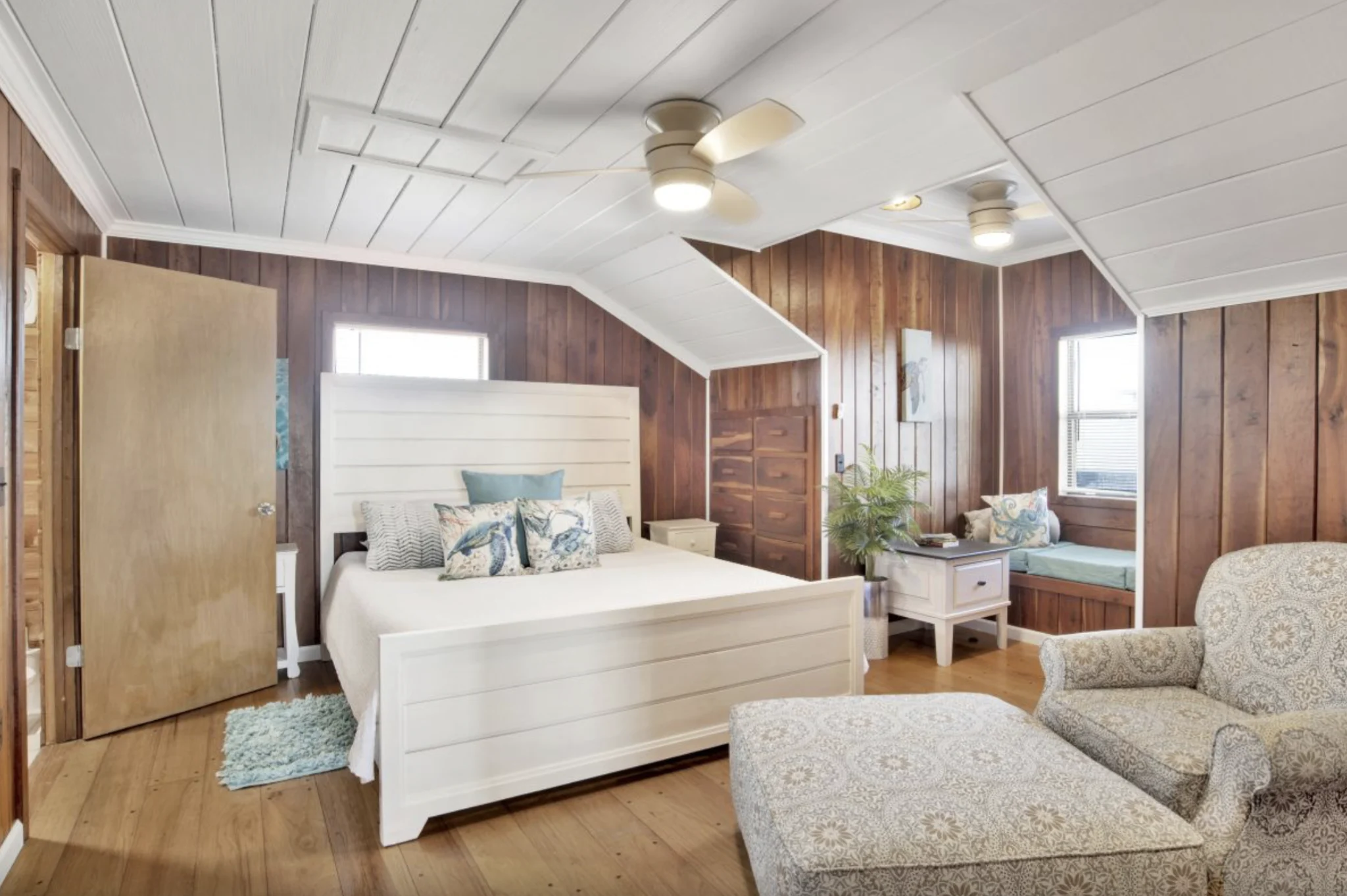 Bedroom with king bed under a sloped ceiling, Tree Tops