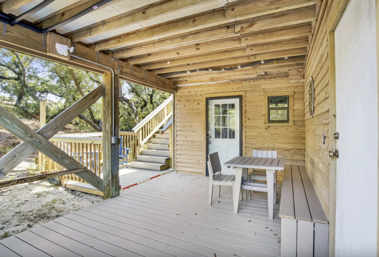 Covered patio with table under the house, Tree Tops