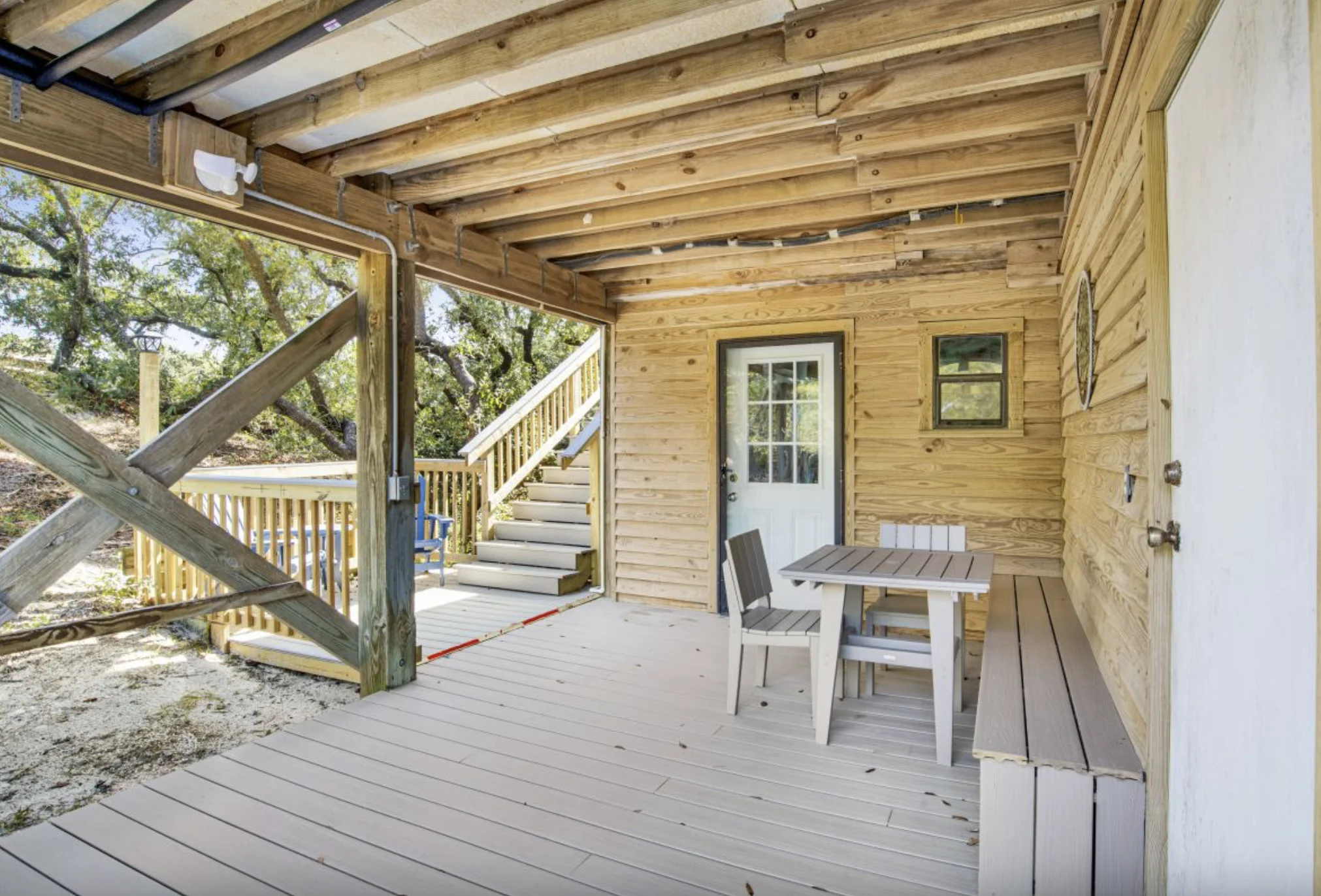 Covered patio with table under the house, Tree Tops