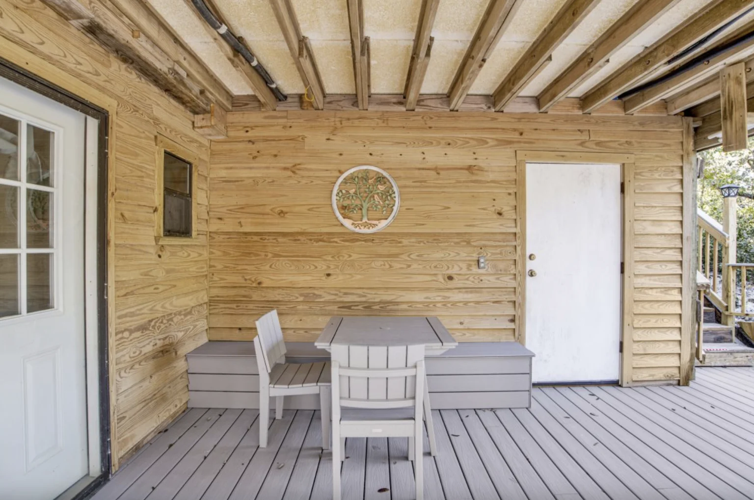 Ground-level patio with table and bench, Tree Tops