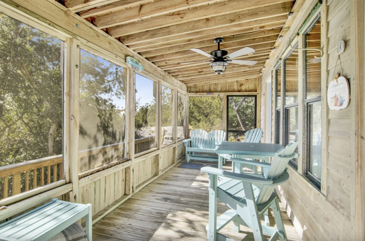 Screened porch with chairs and tree views, Tree Tops