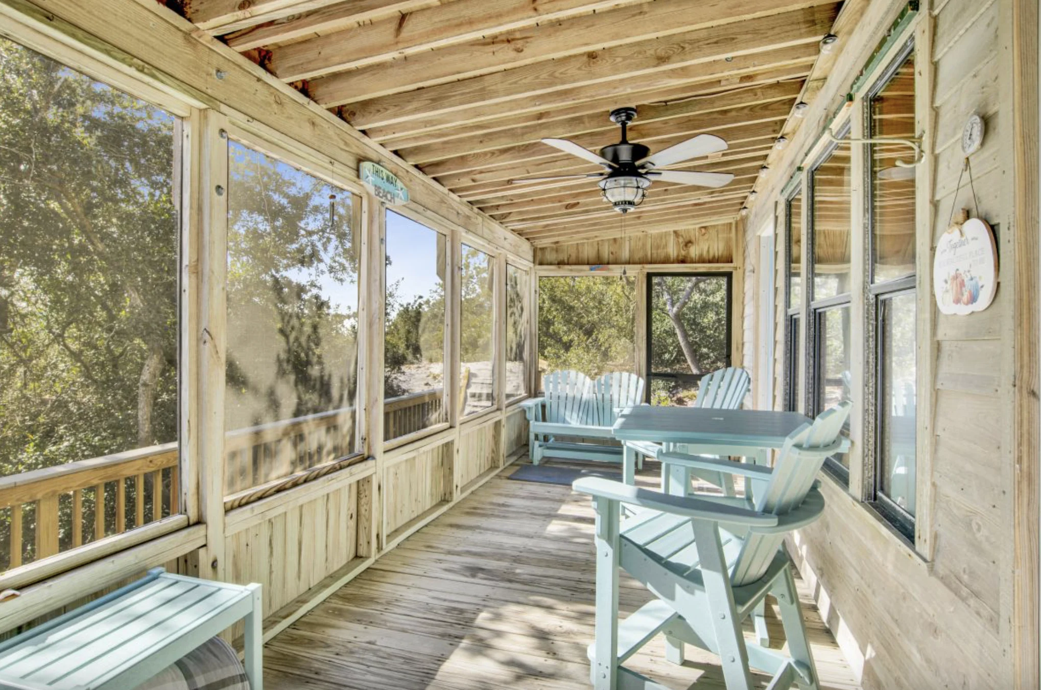 Screened porch with chairs and tree views, Tree Tops