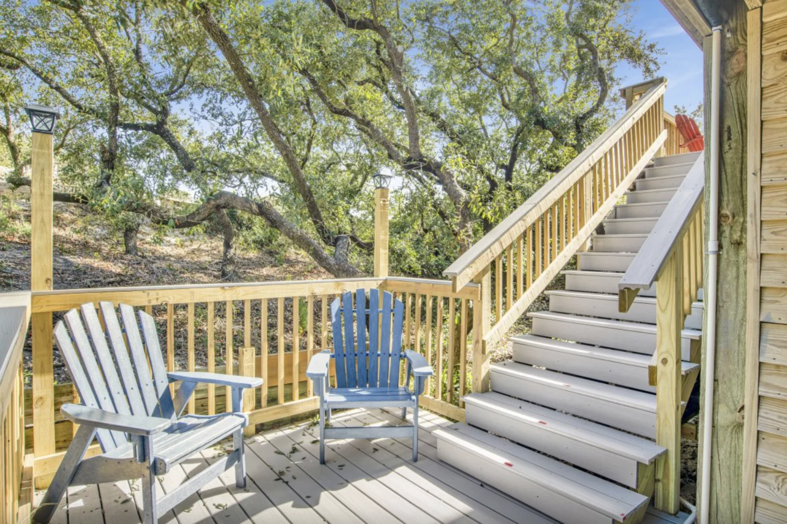 Deck with Adirondack chairs and stairs, Tree Tops