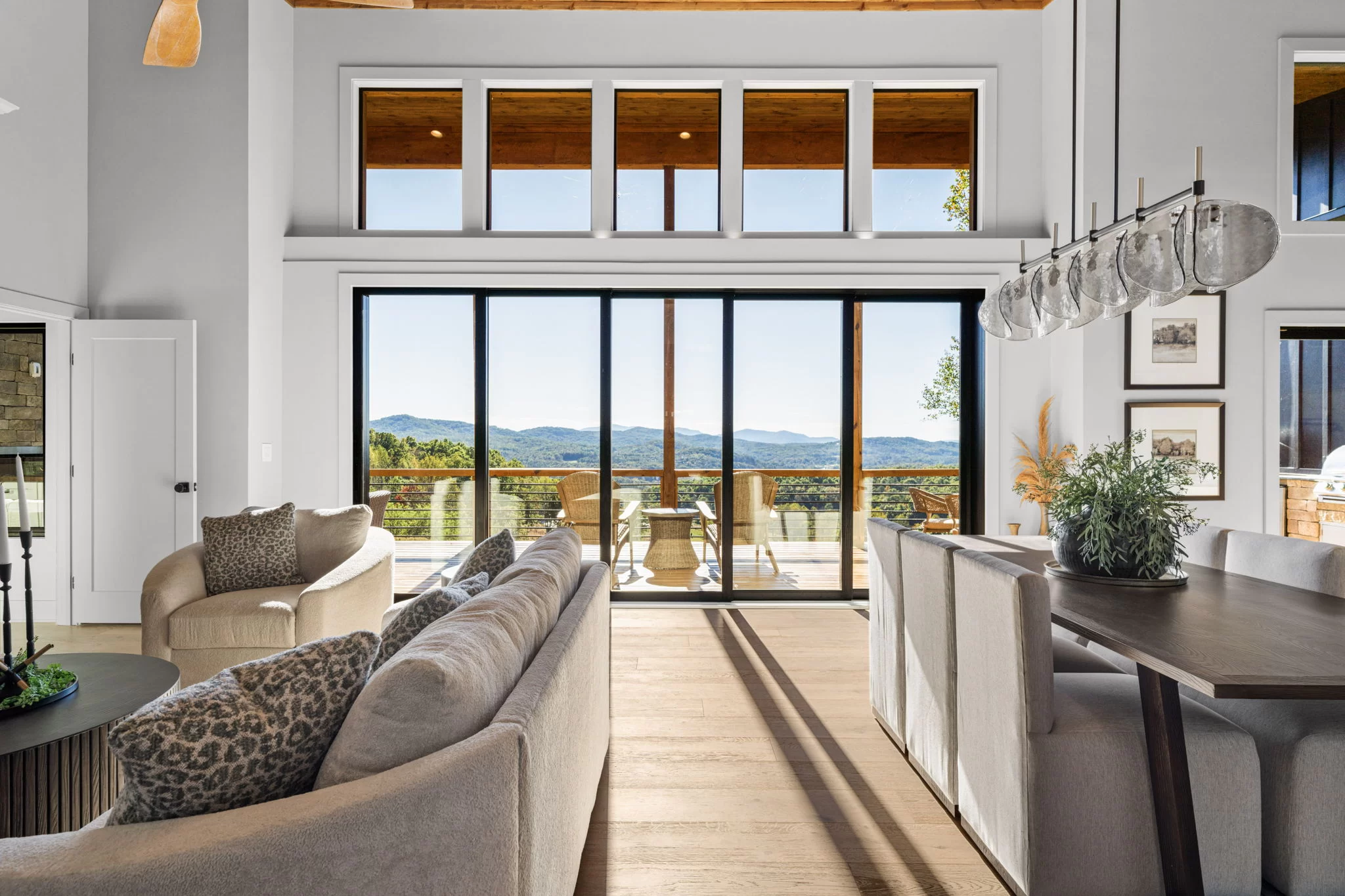 Living room and dining table with glass doors to the deck, View Finder II