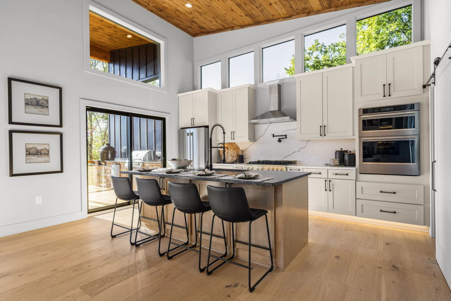 Kitchen island with four bar stools and wall ovens, View Finder II