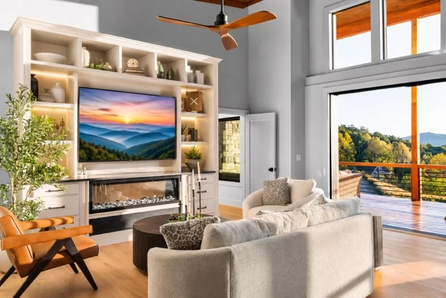 Living room with built-in shelves, TV and a linear electric fireplace, View Finder II