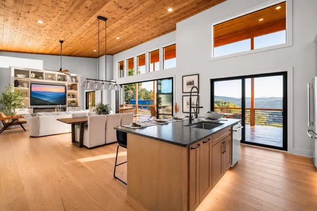 Kitchen island open to the living room and its TV wall, View Finder II
