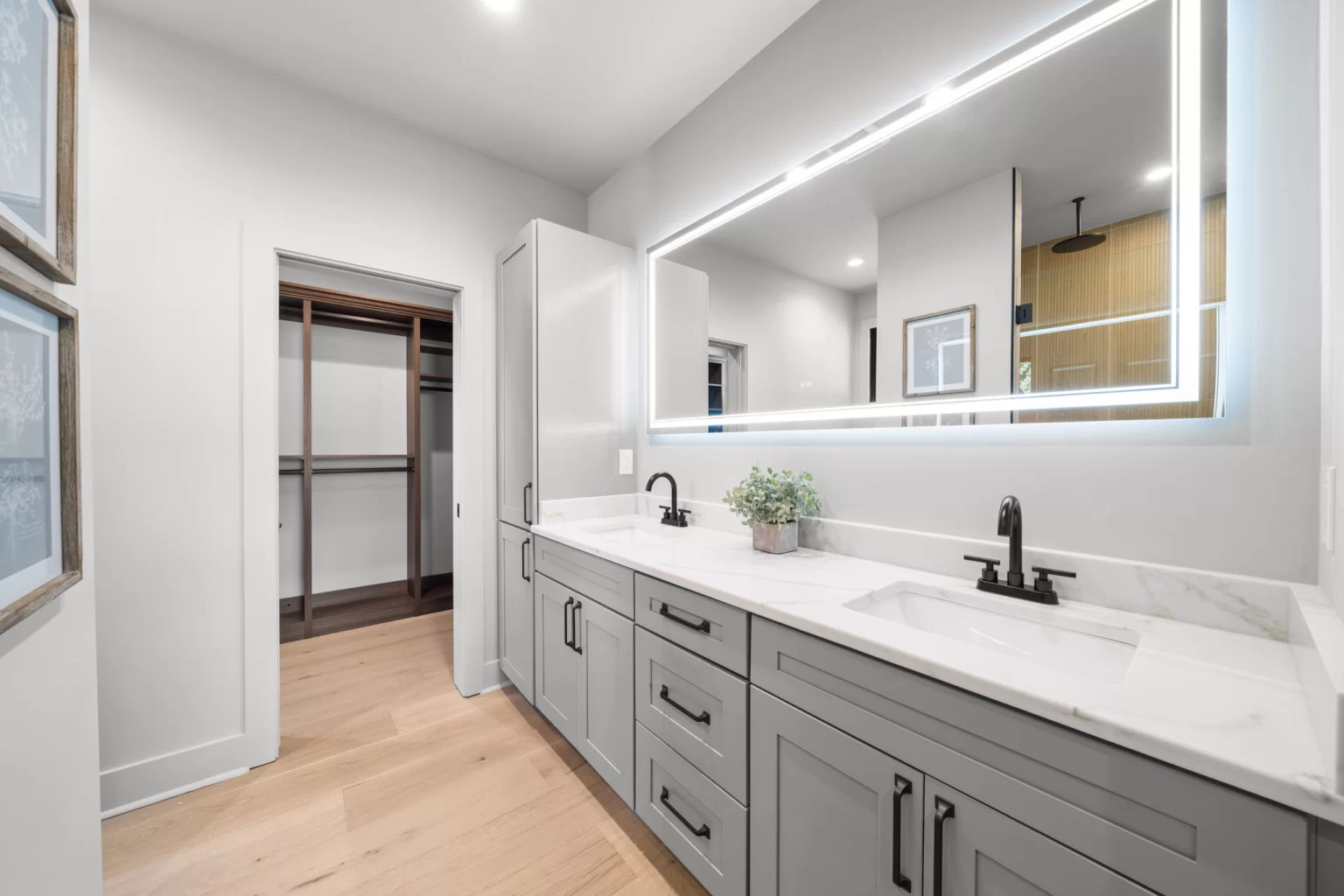 Ensuite bathroom with a double vanity and lit mirror, View Finder II